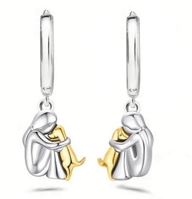 Ein kleines Mädchen und ein Hund umarmen sich - Handgemachte Ohrringe aus Edelstahl für Tierliebhaber - Si.Kreativkauf